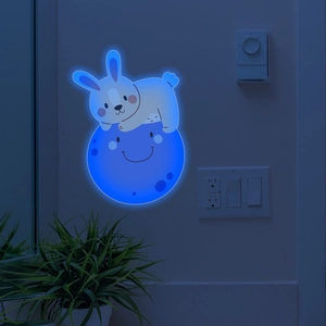 Glow-in-the-dark wall sticker featuring a cute bunny sleeping on a crescent blue moon