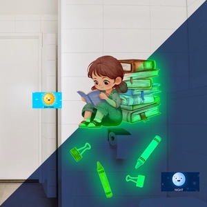 Luminous wall sticker showing a girl reading books with day and night glowing effects