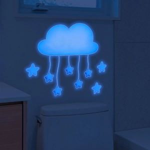 Luminous blue cloud and stars wall sticker glowing in a dark room setting