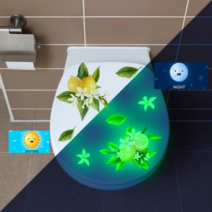Glow-in-the-dark toilet sticker featuring lemon and white flower patterns in day and night views