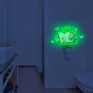 Luminous wall sticker showing cartoon rabbit reading with glowing butterflies and plants
