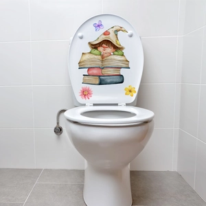 Scene showing luminous elf and flower stickers applied on a white toilet lid decoration
