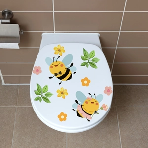 Luminous cartoon bees and flowers waterproof wall stickers applied on white toilet lid