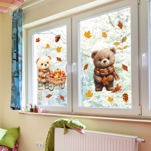Detailed view of autumn window clings featuring cute brown bears and pumpkin carts