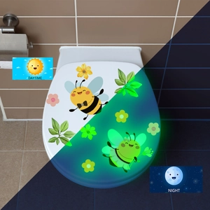 Luminous toilet wall decal showing the visual contrast between daytime and night glow effect