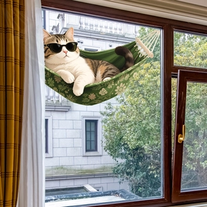 Close-up of a cat in a floral hammock window sticker with outdoor garden background