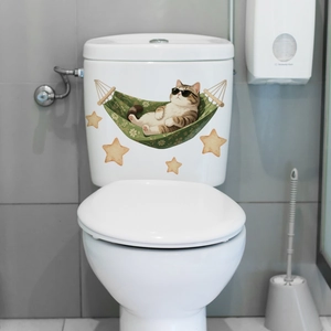 Detail of luminous cartoon cat in hammock toilet sticker with glowing orange stars