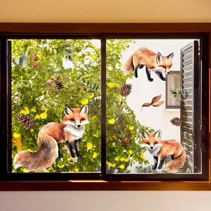 Detailed watercolor fox stickers with forest elements on a glass window pane