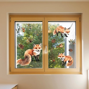 Detailed watercolor window clings showing foxes, pinecones and autumn leaves on glass