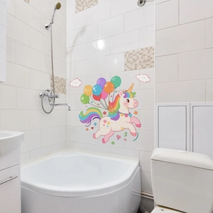 Detail of pink cartoon unicorn wall sticker with colorful balloons on white tile wall