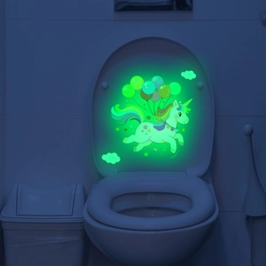 Luminous unicorn wall sticker with balloons glowing green in the dark for bathroom decor