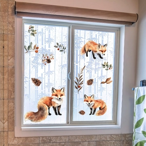 Detail of frosted window film with watercolor fox and forest pattern for privacy