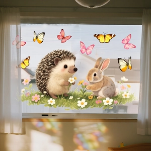 Detail of cartoon hedgehog and bunny static window clings with floral garden stickers