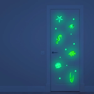 Glow-in-the-dark ocean theme wall decals featuring starfish and seahorse in neon green light