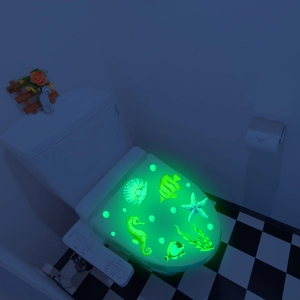 Luminous glow-in-the-dark toilet stickers featuring sea life patterns like seahorses and fish