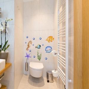Detailed view of ocean themed waterproof wall stickers with seahorse and fish on bathroom tile