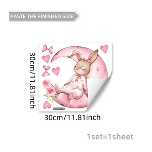 Glow-in-the-dark wall sticker featuring a bunny sleeping on a pink moon with dimension markings