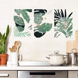 Three-piece set of tropical monstera and palm leaf wall stickers in a kitchen setting