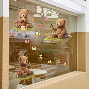 Detail of static window clings featuring cartoon teddy bears, flowers and colorful butterflies