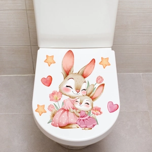 Glow-in-the-dark toilet lid sticker featuring cute hugging rabbits and pink tulips