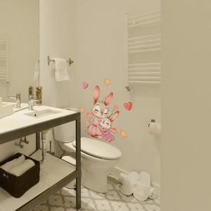 Detail of cute watercolor bunny wall stickers with pink hearts and orange stars in a bathroom