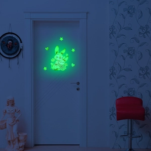 Glow-in-the-dark wall sticker featuring hugging rabbits and stars in dark room setting