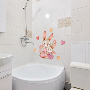 Nursery wall stickers featuring cute hugging bunnies and pink flowers in a bathroom
