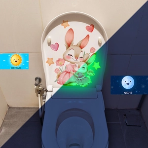 Luminous bunny and tulip toilet lid sticker showing day and night glowing effects