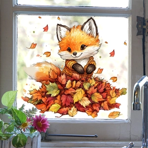 Macro-opname van waterverf vos raamsticker met herfstbladeren op een glazen ruit