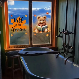 Detail of fall window stickers featuring cute bear reading and Fall is in the air text