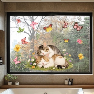 Detail view of cat and butterfly static window clings on glass with floral motifs