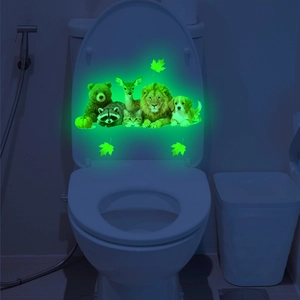 Glow-in-the-dark toilet stickers featuring luminous forest animals and maple leaf patterns