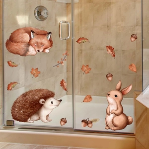 Detailed close-up of autumn forest animals window stickers on glass shower door