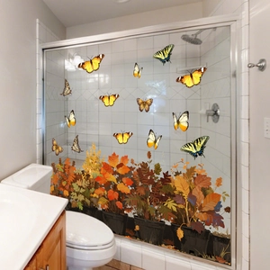Detailed autumn window clings featuring warm-toned butterflies and maple leaves on glass door