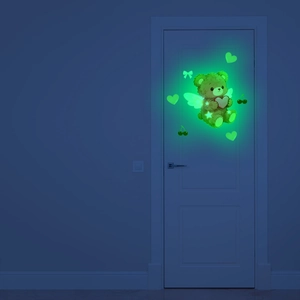 Luminous wall sticker featuring a glowing cartoon winged bear and heart elements