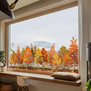 Detailed view of autumn forest window stickers featuring red maple leaves and yellow trees