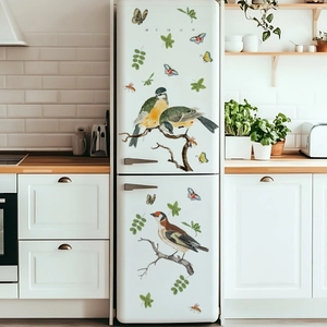 Realistic birds and butterflies wall stickers on a modern white refrigerator door