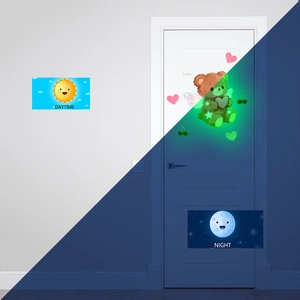 Glow-in-the-dark wall sticker set showing bear and stars in daytime and night modes