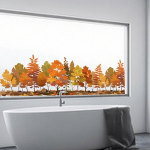 Autumn forest animal window decals shown on a large bathroom window with a white bathtub