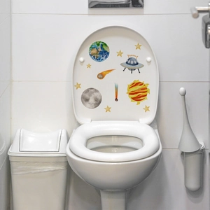 Vibrant watercolor space stickers set featuring Earth and UFO on a white toilet lid