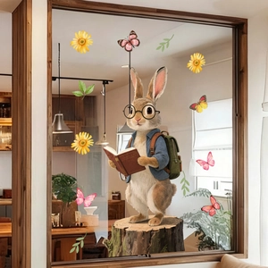 Detail of a cute bunny static window sticker with butterflies and daisy floral accents