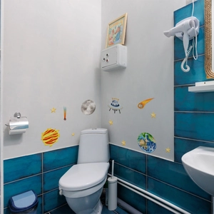 Glow-in-the-dark space wall stickers with cartoon planets and UFO in bathroom