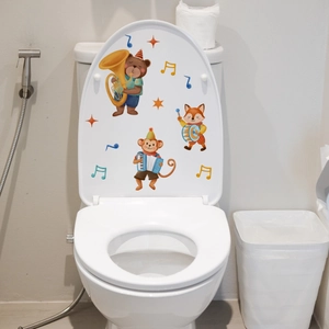 Detailed close-up of cartoon animal band toilet lid decals with bear and fox stickers
