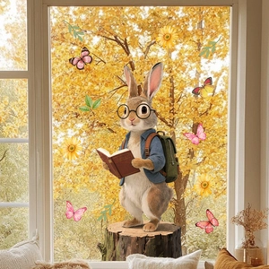 Detail of cartoon rabbit and sunflower static window clings on transparent glass background