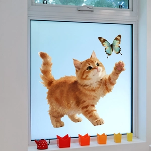 Detail of orange tabby cat and teal butterfly static cling sticker on a glass window