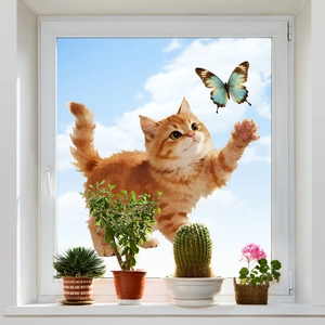 Vivid orange tabby cat chasing a butterfly static window cling decal on a glass window