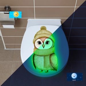 Luminous toilet sticker featuring a cartoon owl with day and night glowing effect view