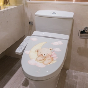 Luminous wall sticker featuring a cute bear sleeping on a moon with pink clouds on a toilet lid