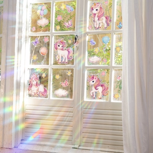 Rainbow unicorn prism window decals showing iridescent light effects on a home window glass