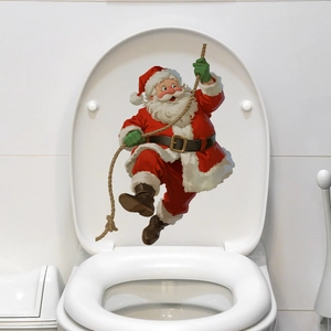 Detailed view of festive Santa Claus climbing rope decal applied to a white toilet lid